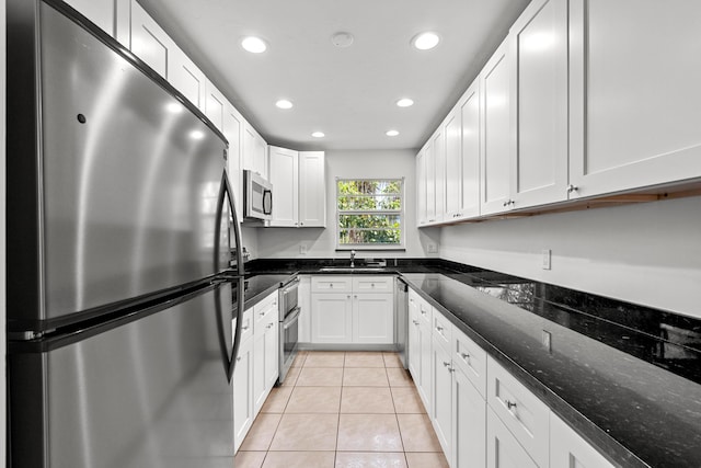 kitchen featuring light tile patterned floors, appliances with stainless steel finishes, recessed lighting, and white cabinetry