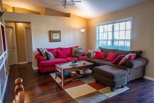 living area with vaulted ceiling, ceiling fan, dark wood-style flooring, and baseboards