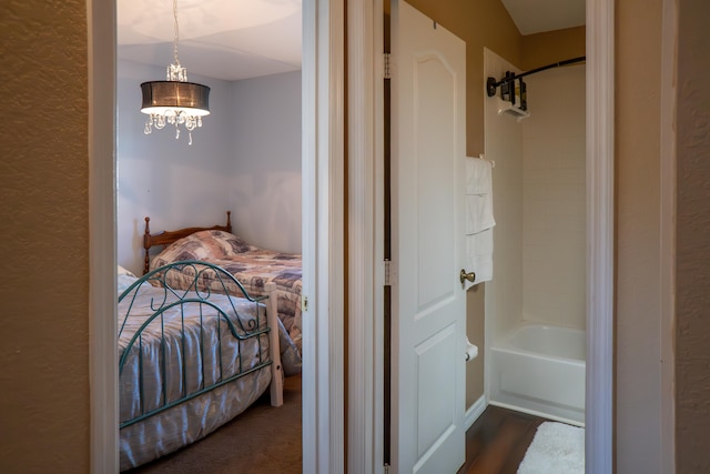 bedroom featuring a chandelier