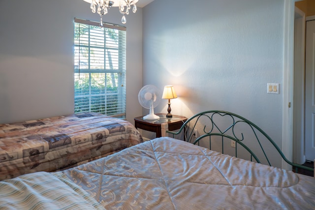 bedroom featuring a chandelier