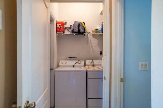 laundry area with laundry area and washer and clothes dryer