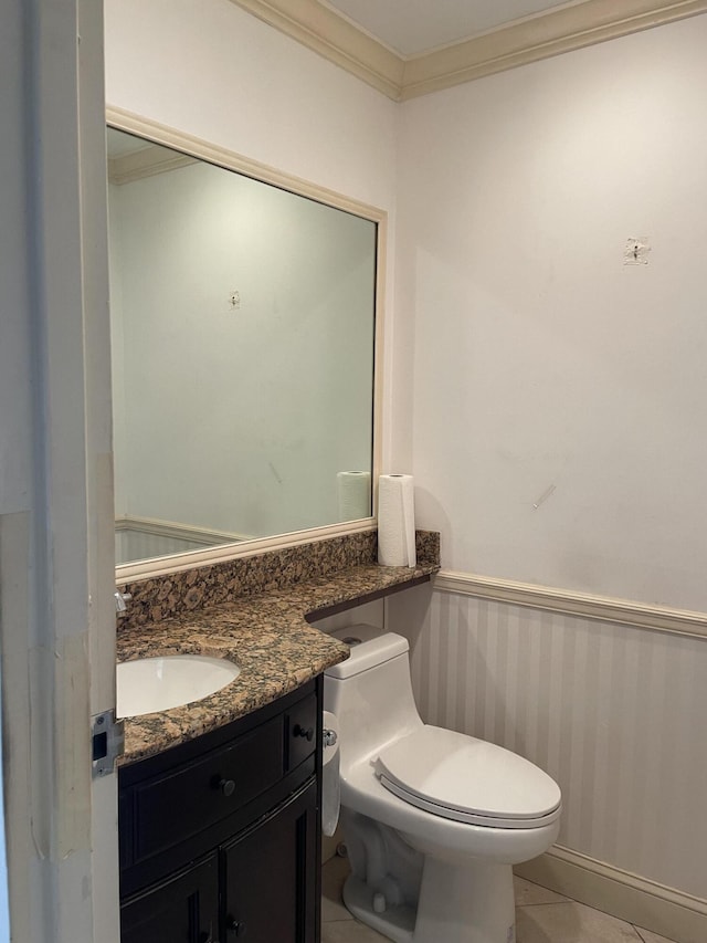 138 Monaco C, Delray Beach, FL 33446 - bathroom featuring ornamental molding, vanity, toilet, and tile patterned floors