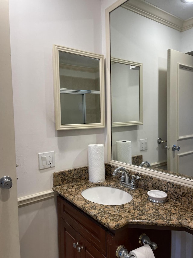 138 Monaco C, Delray Beach, FL 33446 - bathroom with ornamental molding and vanity