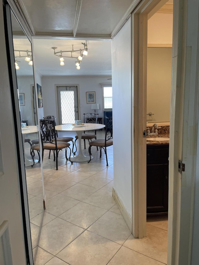 138 Monaco C, Delray Beach, FL 33446 - interior space with ornamental molding, track lighting, and light tile patterned floors