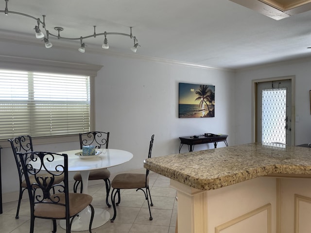 138 Monaco C, Delray Beach, FL 33446 - dining area with light tile patterned floors, track lighting, and crown molding