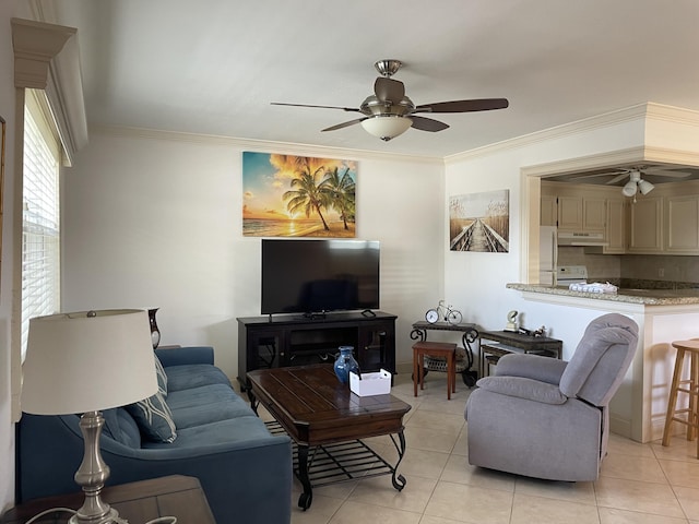 138 Monaco C, Delray Beach, FL 33446 - living area featuring light tile patterned floors, ornamental molding, and a ceiling fan