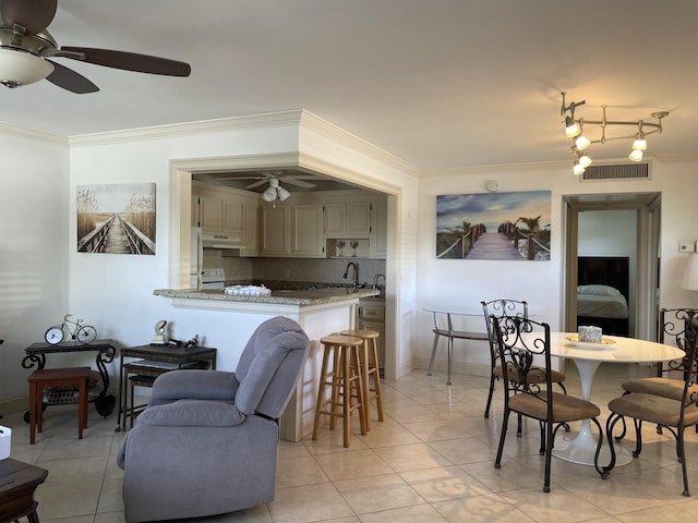 138 Monaco C, Delray Beach, FL 33446 - dining area featuring light tile patterned floors, ornamental molding, visible vents, and baseboards