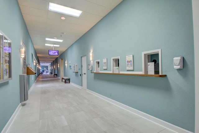 138 Monaco C, Delray Beach, FL 33446 - hall with stairs, a drop ceiling, and baseboards