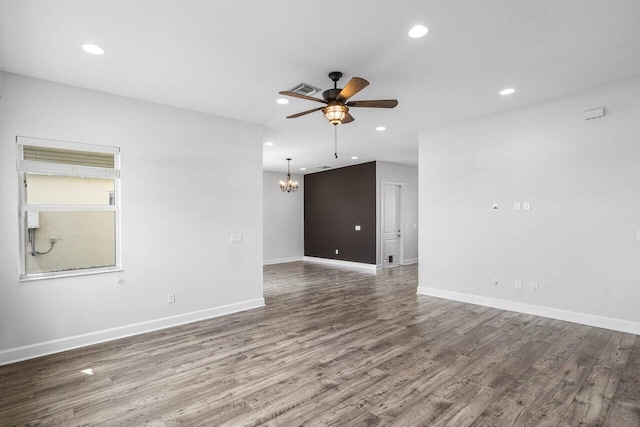 15262 Goldfinch Cir, Westlake, FL 33470 - unfurnished room featuring ceiling fan, a chandelier, wood finished floors, recessed lighting, and baseboards