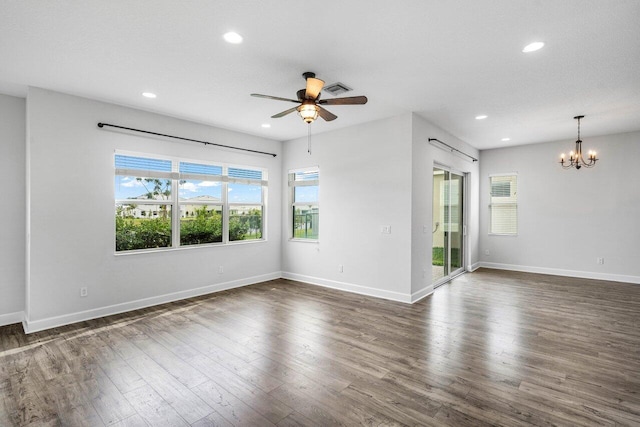 15262 Goldfinch Cir, Westlake, FL 33470 - spare room with a chandelier, ceiling fan, recessed lighting, baseboards, and dark wood-style flooring