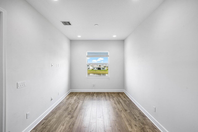 15262 Goldfinch Cir, Westlake, FL 33470 - empty room featuring wood finished floors, recessed lighting, and baseboards