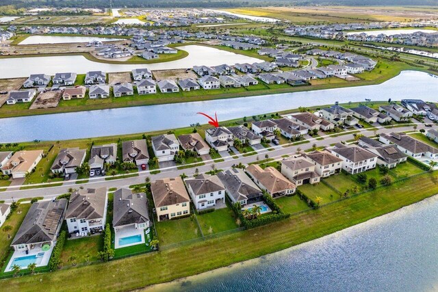 15262 Goldfinch Cir, Westlake, FL 33470 - aerial view of property's location with nearby suburban area and a nearby body of water