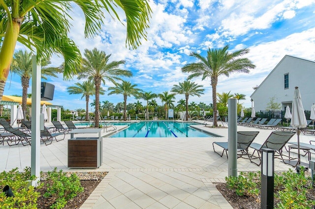 community pool with a patio area