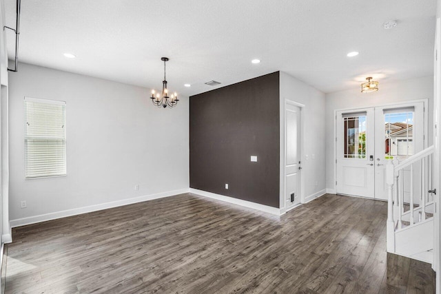 15262 Goldfinch Cir, Westlake, FL 33470 - entryway featuring a chandelier, dark wood-type flooring, baseboards, recessed lighting, and french doors