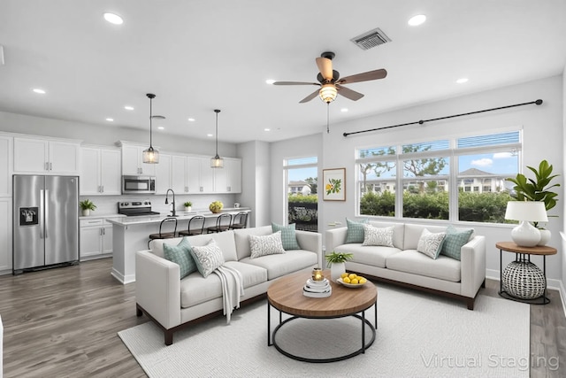 15262 Goldfinch Cir, Westlake, FL 33470 - living room with a ceiling fan, recessed lighting, wood finished floors, and baseboards
