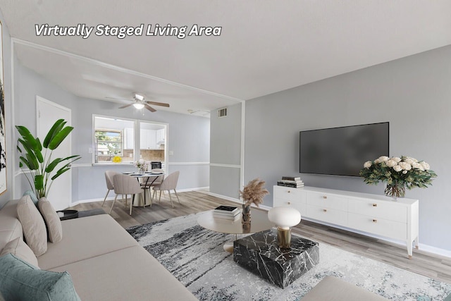 10821 N Military Trl Unit 2, Palm Beach Gardens, FL 33410 - living area with wood finished floors, baseboards, and ceiling fan