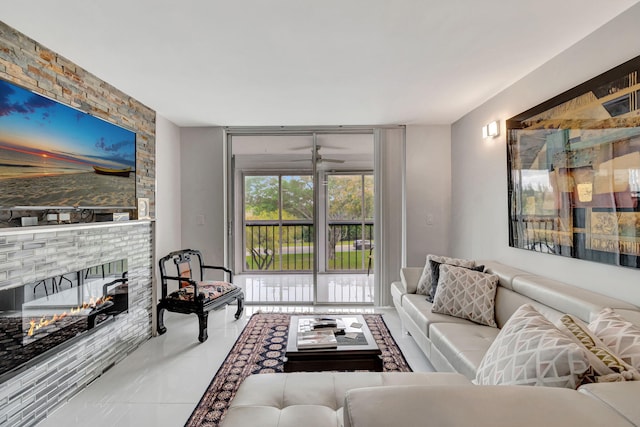 living area with expansive windows, a multi sided fireplace, and tile patterned floors