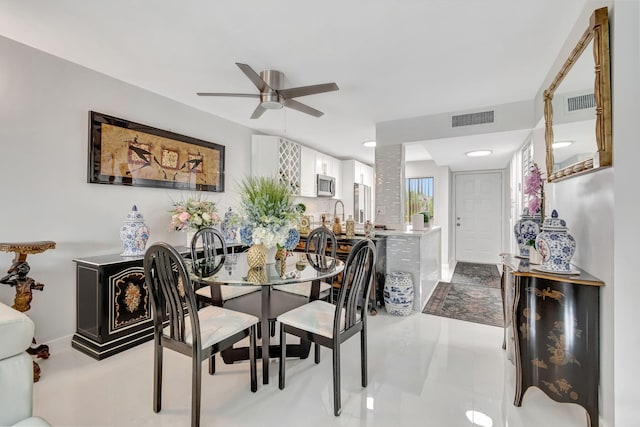 dining area with visible vents and ceiling fan