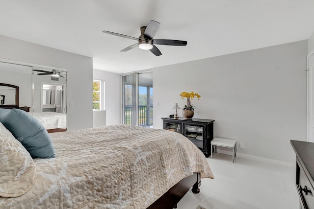 bedroom with access to outside, ceiling fan, and baseboards