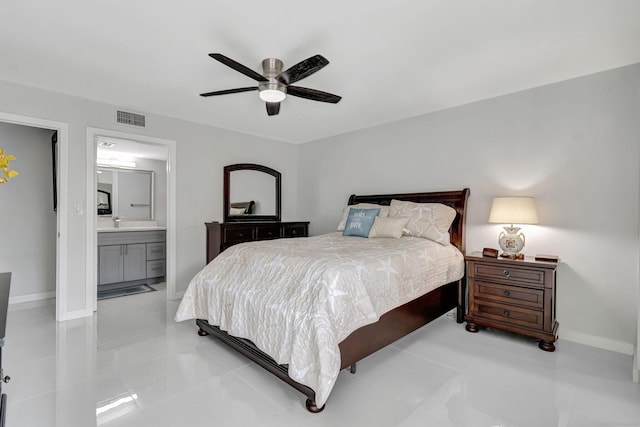 bedroom featuring light tile patterned floors, a ceiling fan, visible vents, baseboards, and ensuite bath