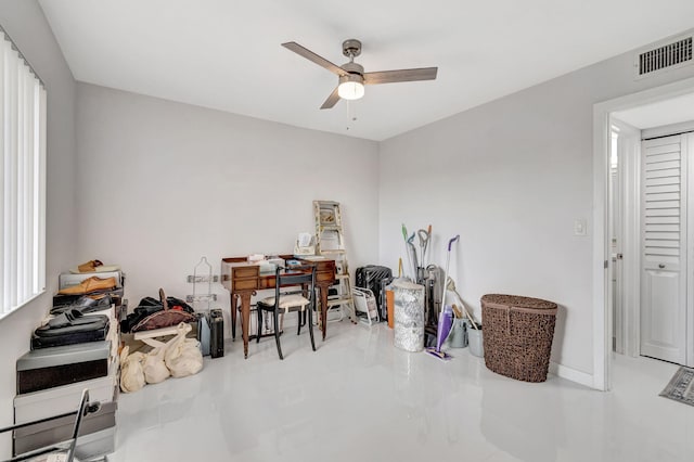 miscellaneous room featuring ceiling fan, visible vents, and baseboards