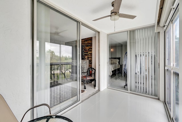 interior space featuring a ceiling fan and a healthy amount of sunlight