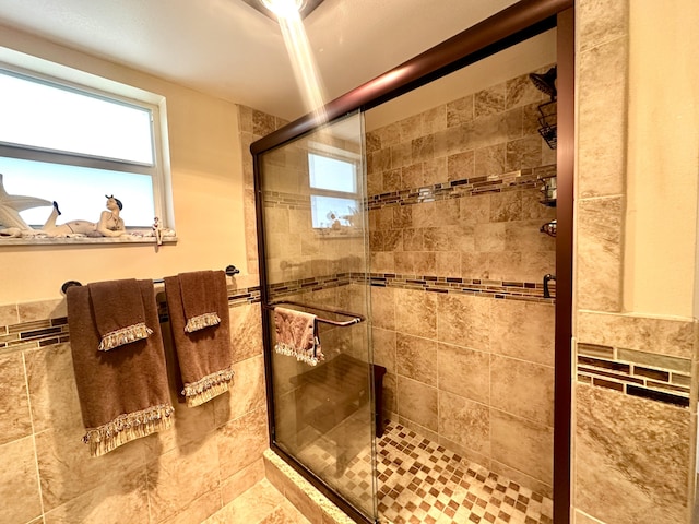 bathroom featuring a shower stall