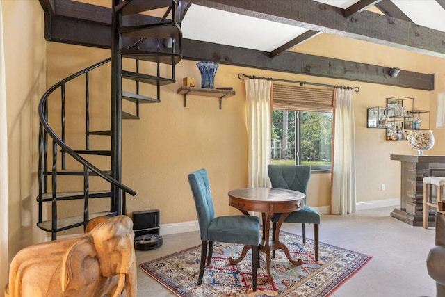 dining area with stairs, baseboards, and beam ceiling