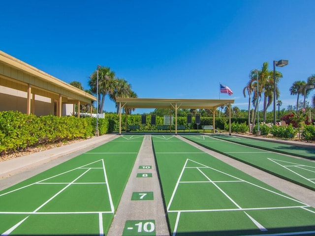 view of property's community featuring shuffleboard