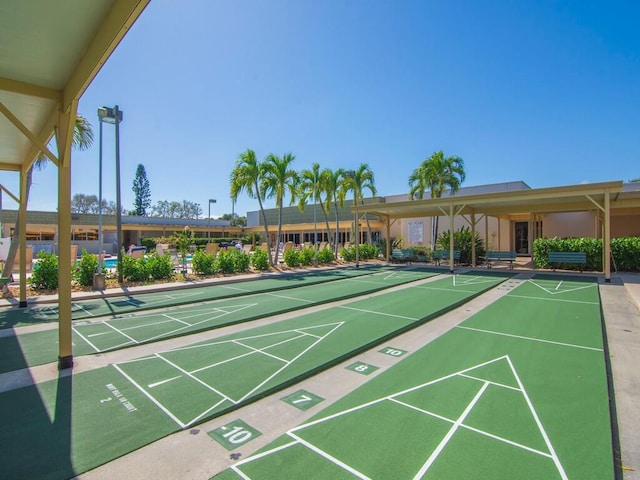 view of home's community featuring shuffleboard