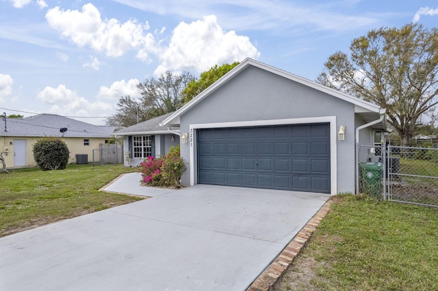 single story home featuring an attached garage, driveway, a gate, stucco siding, and a front yard