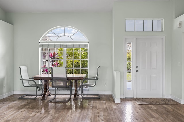 entryway featuring wood finished floors and baseboards