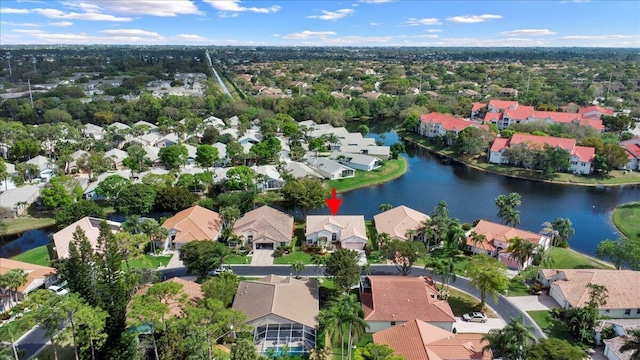 birds eye view of property featuring a water view and a residential view