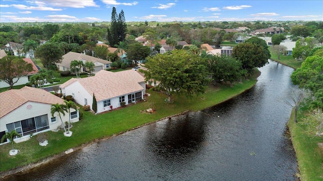 birds eye view of property featuring a residential view and a water view