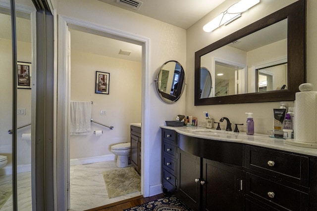 full bathroom with toilet, vanity, visible vents, baseboards, and marble finish floor