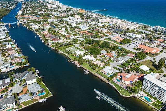 view of property location featuring a nearby body of water and nearby urban area