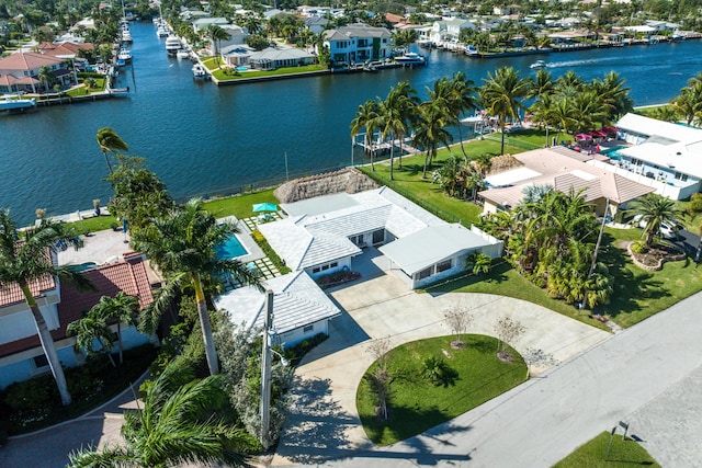 aerial perspective of suburban area with a nearby body of water