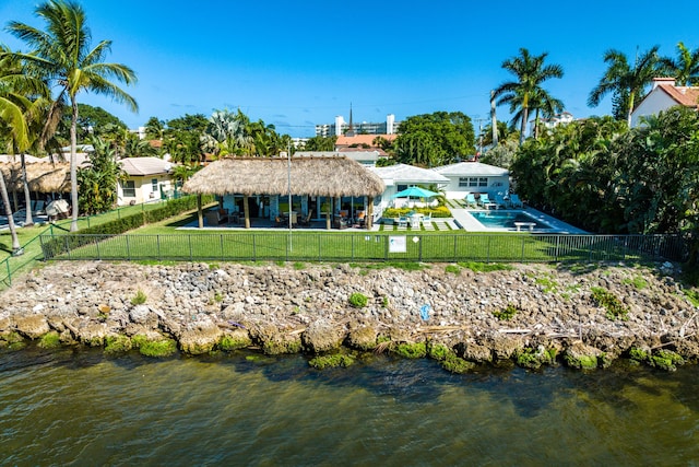 rear view of property with a patio and a water view