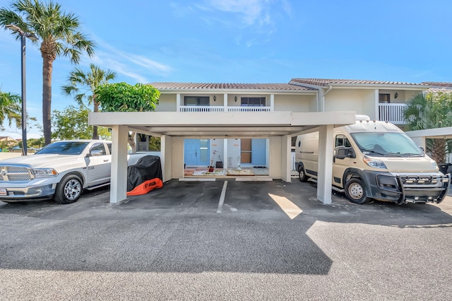 view of partially covered parking lot