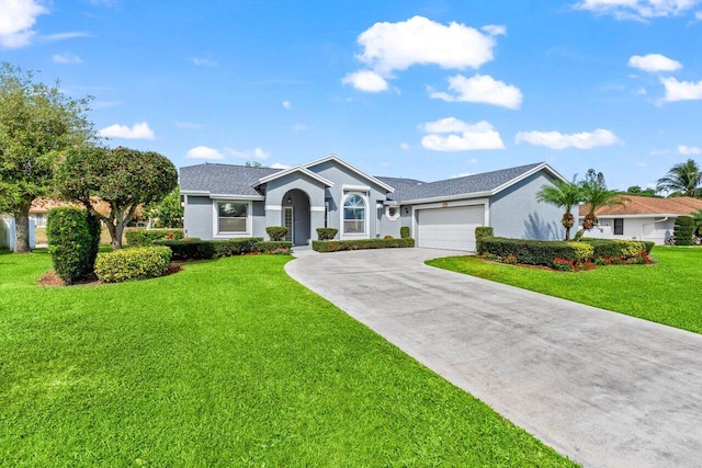 single story home with a garage, stucco siding, driveway, and a front yard