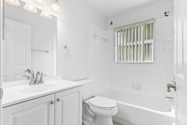 full bath featuring toilet, bathtub / shower combination, and vanity