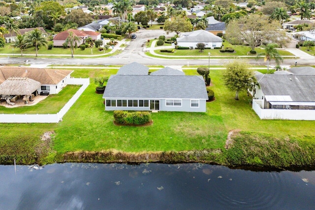 birds eye view of property featuring a water view and a residential view