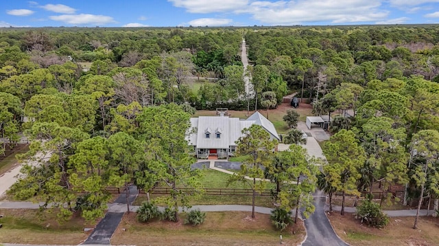 drone / aerial view with a view of trees