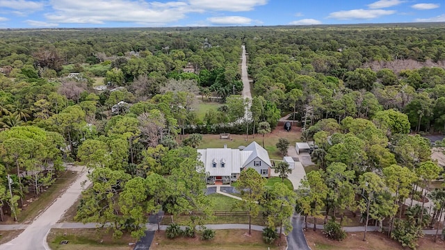 aerial view featuring a wooded view