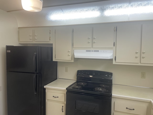 kitchen featuring black appliances, light countertops, mail area, and under cabinet range hood