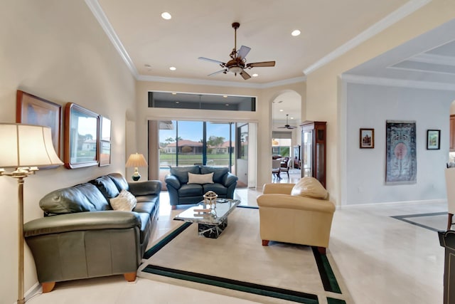 living area featuring recessed lighting, crown molding, arched walkways, and ceiling fan