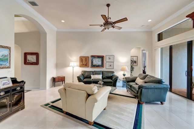 living room with arched walkways, recessed lighting, visible vents, ornamental molding, and light tile patterned flooring