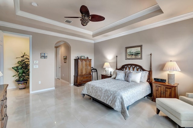 bedroom with visible vents, a raised ceiling, arched walkways, and ornamental molding