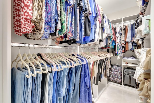 spacious closet featuring tile patterned flooring