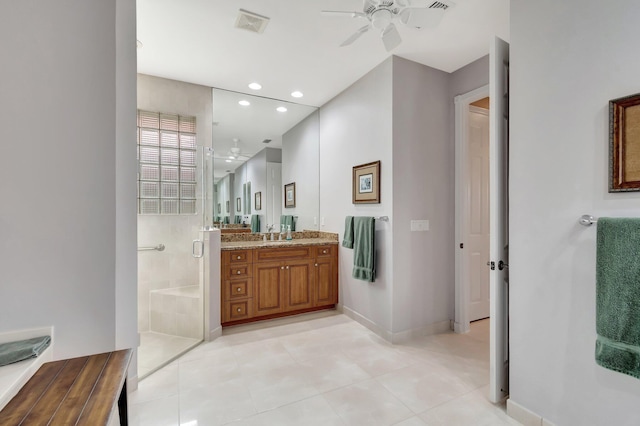 bathroom with ceiling fan, recessed lighting, vanity, baseboards, and a stall shower